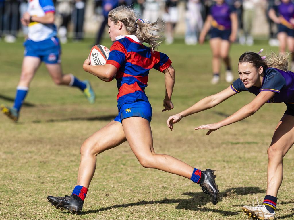 Jess Fitzgibbons on the way to a Downlands try in the final game against Glennie in rugby sevens Selena Worsley Shield on Grammar Downlands Day at Downlands College, Saturday, August 6, 2022. Picture: Kevin Farmer