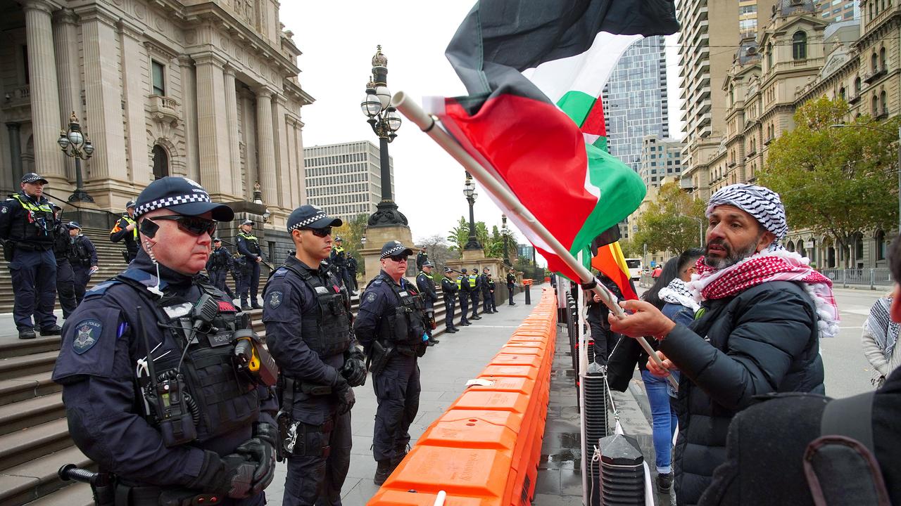 Protesters waved Palestinian flags and wore traditional keffiyeh. Picture: NCA NewsWire / Luis Enrique Ascui