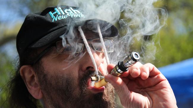 A man smokes marijuana during a 420 celebration at Washington Square Park in New York City on April 20, 2024. April 20 is an unofficial international counterculture celebration of cannabis. Picture: AFP