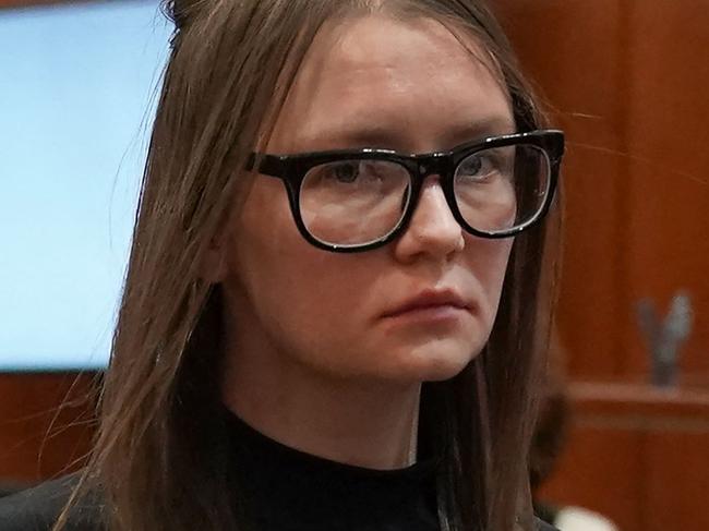 (FILES) In this file photo taken on May 9, 2019 Anna Sorokin is led away after being sentenced in Manhattan Supreme Court following her conviction last month on multiple counts of grand larceny and theft of services. - Fake heiress Anna "Delvey" Sorokin, who was jailed in 2019 for scamming hundreds of thousands of dollars from hotels, banks and friends, and who inspired a hit series on Netflix, was to be extradited to Germany on March 14, 2022, US media said. (Photo by TIMOTHY A. CLARY / AFP)