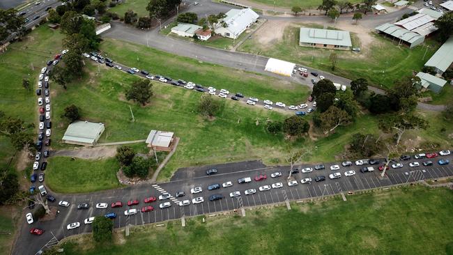 Lines of cars waiting for a Covid-19 test at the Castle Hill Showground in northwest Sydney on Wednesday. Picture: Jonathan Ng