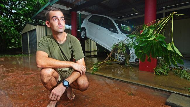 Llewellyn Kingston in front of his partner’s car on his property on Forestry Road, Bluewater after flood waters swept through the house. Picture: Zak Simmonds