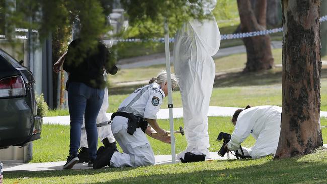 Forensic police arrive at the scene of the shooting in Glendale. Picture by Peter Lorimer.