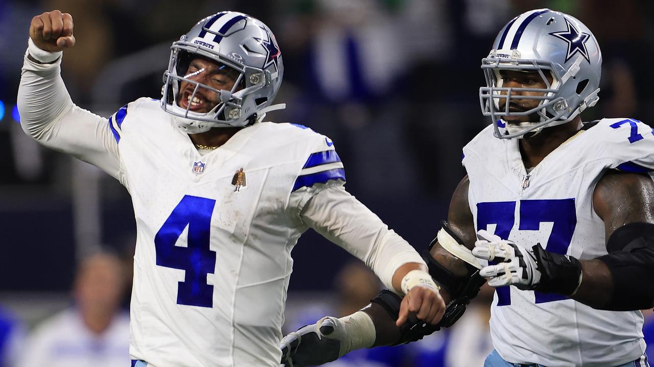 ARLINGTON, TEXAS - NOVEMBER 30: Quarterback Dak Prescott #4 of the Dallas Cowboys celebrates with offensive tackle Tyron Smith #77 after throwing for a touchdown during the 4th quarter of the game against the Seattle Seahawks at AT&amp;T Stadium on November 30, 2023 in Arlington, Texas. (Photo by Ron Jenkins/Getty Images)