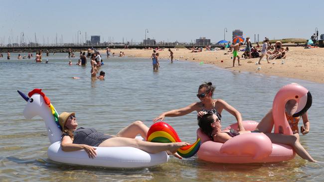 Beachgoers cool off at Kilda beach in Melbourne. Picture: AAP Image/David Crosling