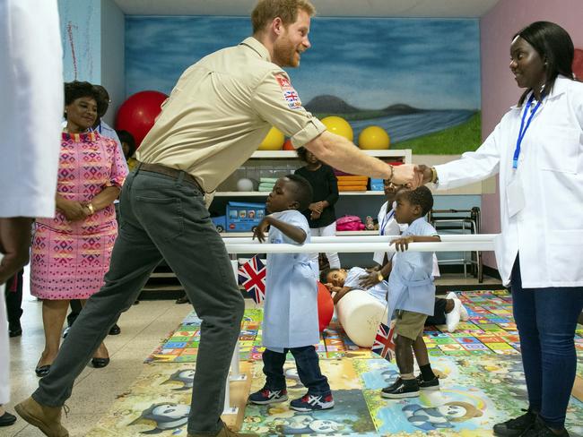 Prince Harry meets staff and patients at the Princess Diana Orthopaedic Centre in Huambo, Angola. Picture: AP