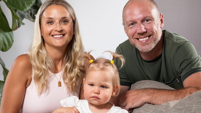 Two-year-old Luella pictured with her parents Erin and Dave. Picture: Julian Andrews