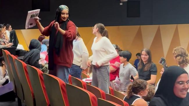 Anti-Israel students at the University of Sydney turn their backs on a Jewish speaker on Wednesday night.