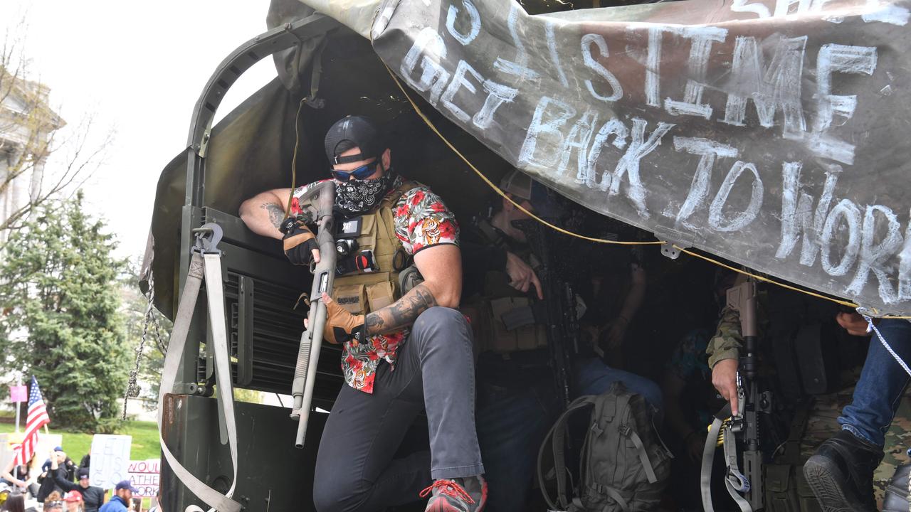 Many of the posts seeking to organise protests appear to have links to gun groups. Picture: Nicholas Kamm / AFP