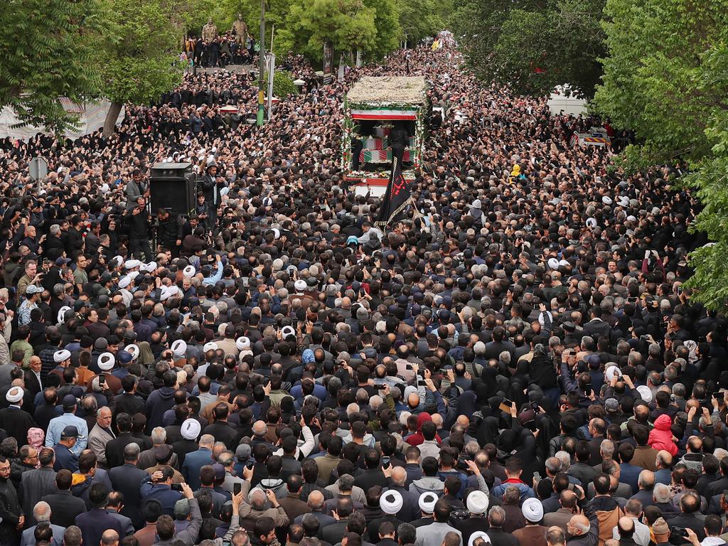 Mourners walking in the funeral procession in Tabriz, the capital of Iran's East Azerbaijan province, of late president Ebrahim Raisi and seven others killed with him in a helicopter crash. Picture: AFP