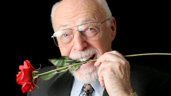 RendezView. A handsome senior man with a red rose in his teeth. (Pic: iStock)