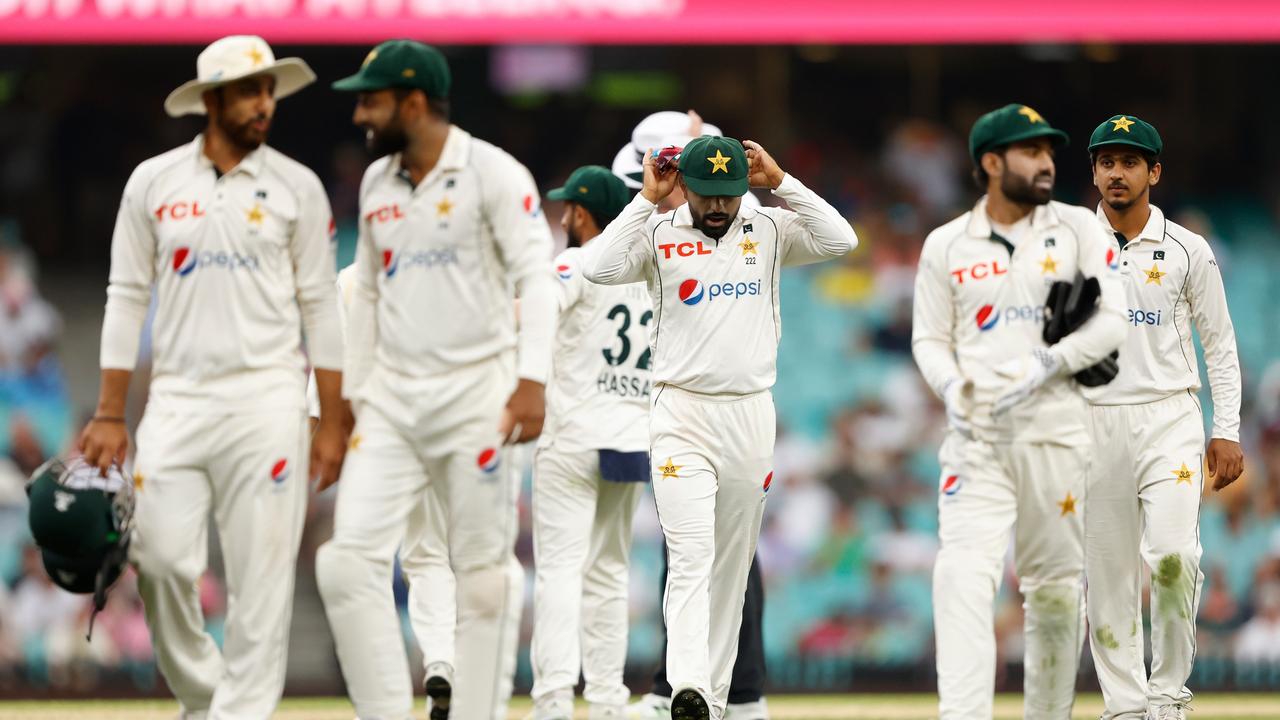 Pakistan’s players walk off the field after bad light suspended play. Picture: Getty