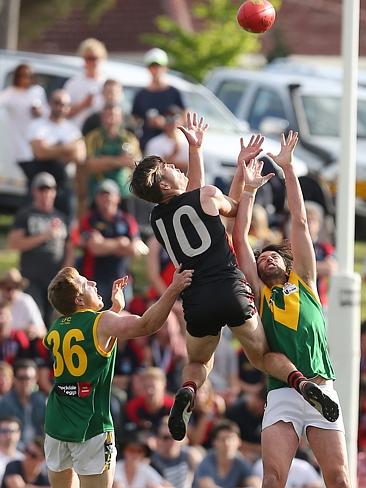 Gippsland Football League Grand Final match between Maffra Eagles and Leongatha Parrots. Maffra became the 2016 premiers, defeating Leongatha 13.10 (88) to 9. 16 (67). Lachlan Channing takes a leaping mark over Matthew Borschman and Aaron Coyle. Picture: Yuri Kouzmin