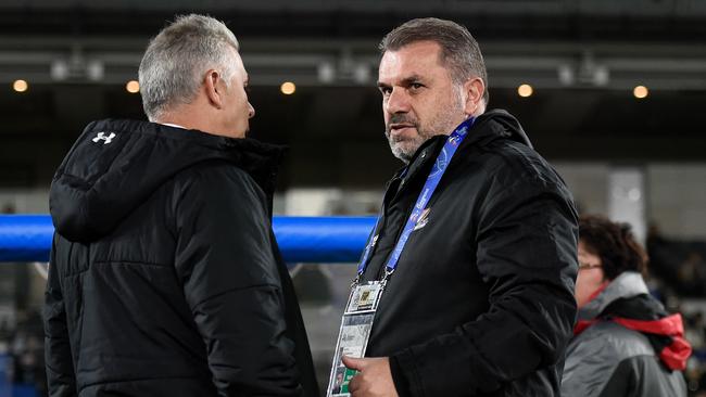 Yokohama F.Marinos coach Ange Postecoglou (right) and Sydney FC coach Steve Corica chat on Wednesday night. Picture: Getty Images