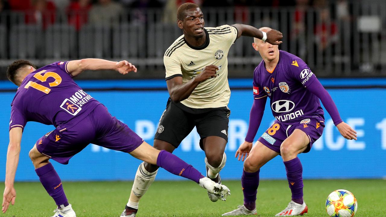 Paul Pogba takes the ball forward for Manchester United against Perth Glory on Saturday night. Picture: AAP