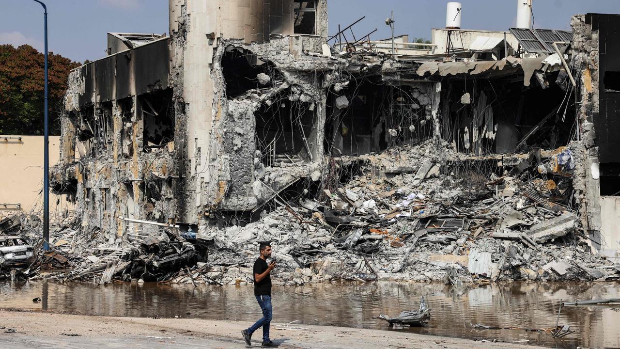 A man walks past an Israeli police station in Sderot after it was damaged during battles to dislodge Hamas militants who were stationed inside. Picture: AFP