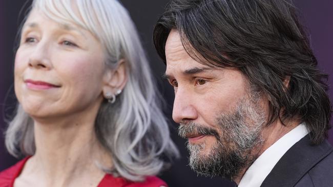 Alexandra Grant, left, and Keanu Reeves arrive at the premiere of 