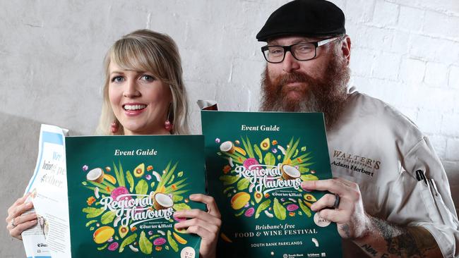 Chef Adam Herbert and Georgia Barnes take a look at the Regional Flavours Guide. Picture: Liam Kidston