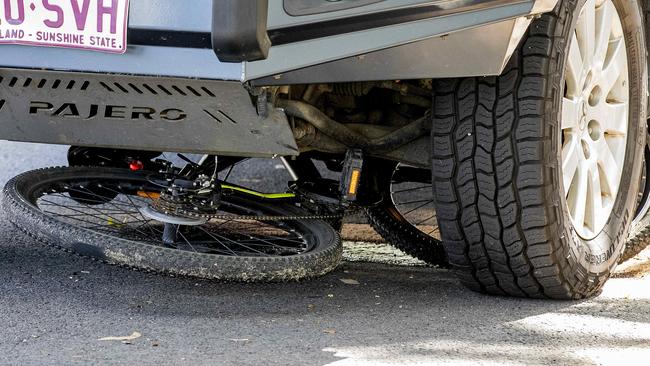 The bike underneath the car. Picture: Jerad Williams