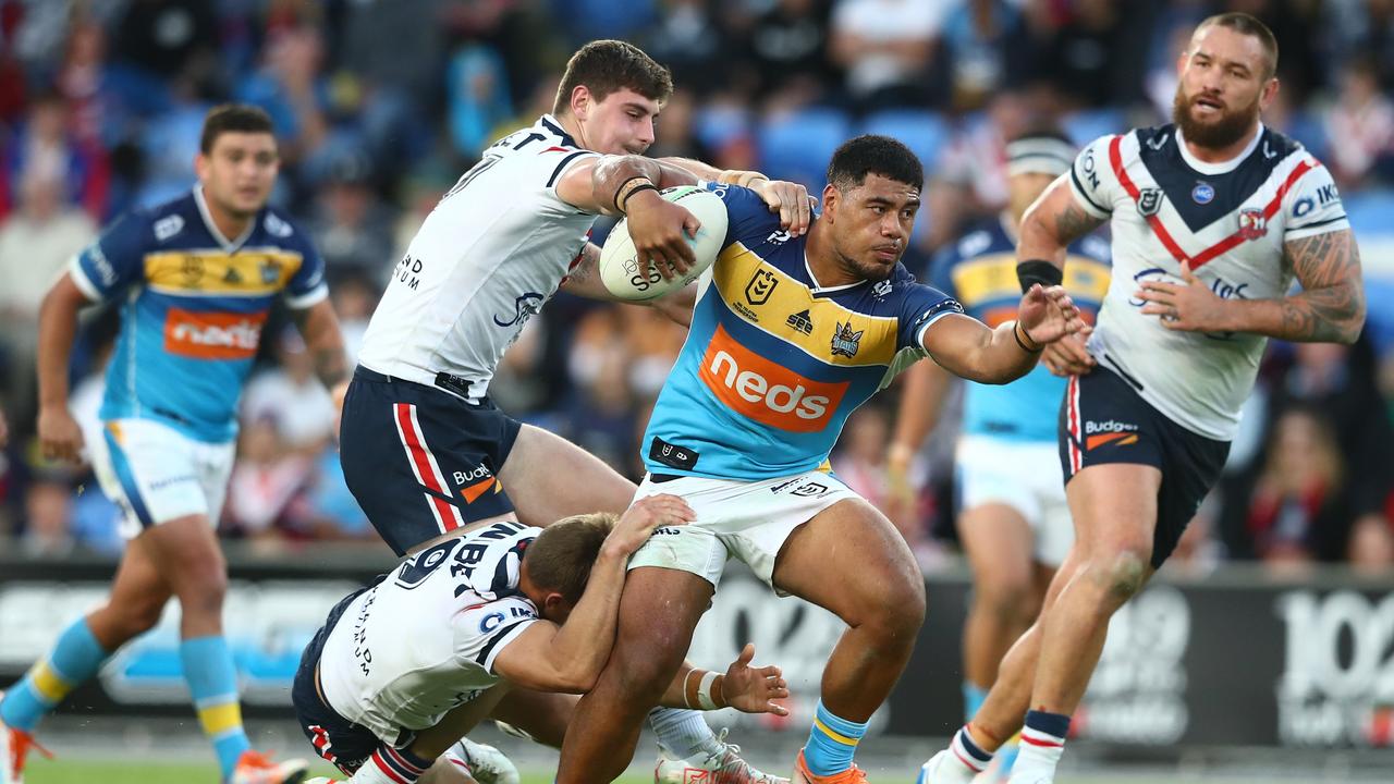 Gold Coast winger Greg Marzhew makes another barnstorming run. (Photo by Chris Hyde/Getty Images)