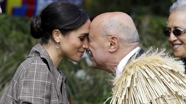 Meghan, Duchess of Sussex receives a "hongi" — a traditional Maori welcome — on the lawns of Government House in Wellington on Sunday. Picture: AP