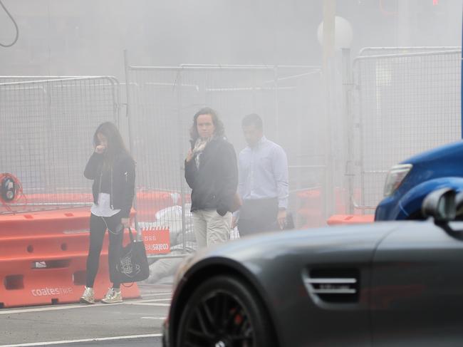 Works on the light rail opposite Town hall engulfed pedestrians and traffic in smoke in early July. Picture: John Grainger