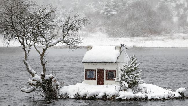 The Wee Hoose, or Broons Hoose, stands out in the snow on Loch Shin, Scotland, as temperatures plummeted to -14C. Picture: Jeff J Mitchell/Getty Images