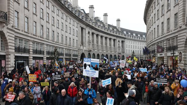 Activists from the World Wide Rally For Freedom and NHS100K protests march down Regent Street in London. Photo: Getty Images.