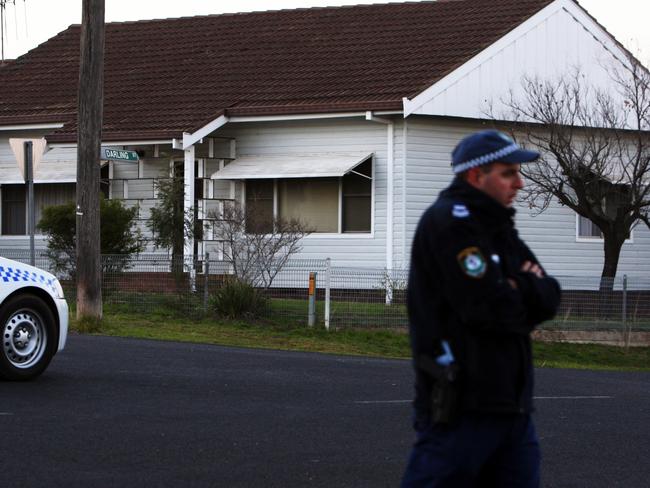 Police guard the scene of John Walsh’s family murders in Cowra in 2008.