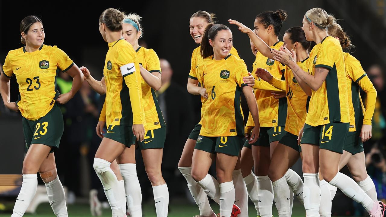 Clare Wheeler celebrates with teammates after scoring against China. Picture: Matt King/Getty Images