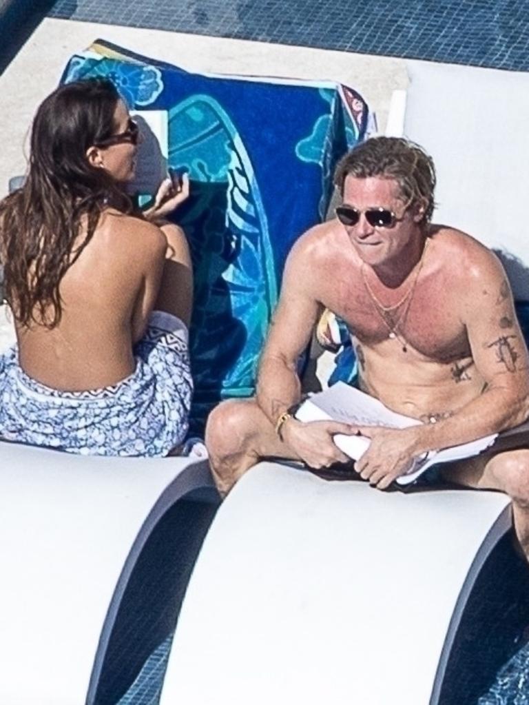 Brad’s got the tummy out as he enjoys some sun with his love. Picture: Backgrid