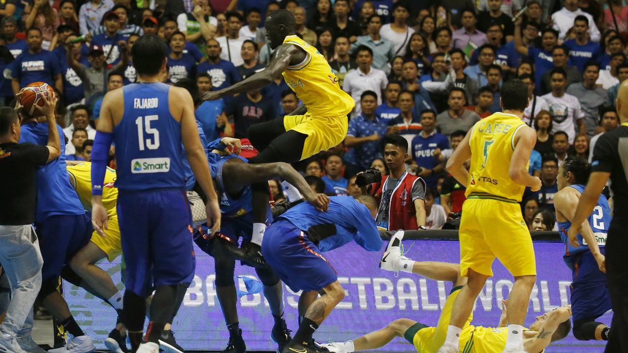 Thon Maker flies through the air with a kick as his Boomer’s teammates are set upon during a wild brawl with the Philipines.