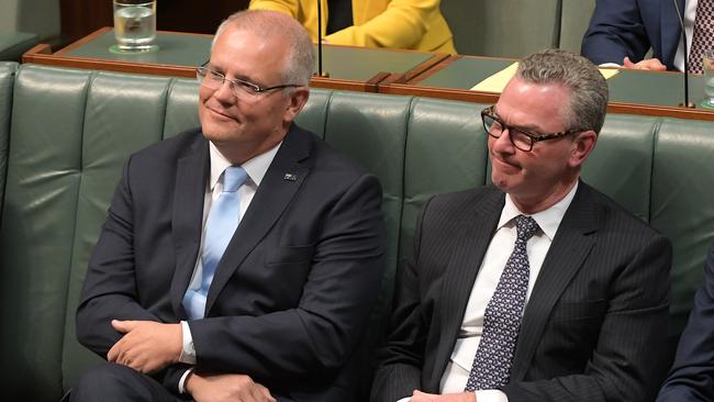 Prime Minister Scott Morrison and Member of the Australian House of Representatives Christopher Pyne listen to Treasurer Josh Frydenberg. Picture: Tracey Nearmy/Getty 