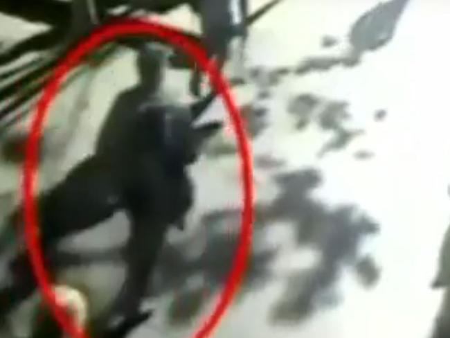 Man Monis walks towards the Lindt Cafe. Picture: 7 News Sydney