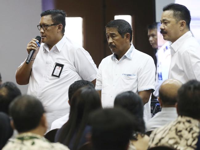 Director of Safety and Security of Lion Air, Daniel Putut Kuncoro Adi, left, talks to relatives of victims of crashed Lion Air jet. Picture: AP