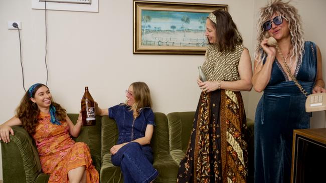 Georgina Campbell, Caddie Brain, Kellie Josig, and Nicole Ogilvie dressed in their 70s-themed outfits ahead of MAGNT Selfie Day.