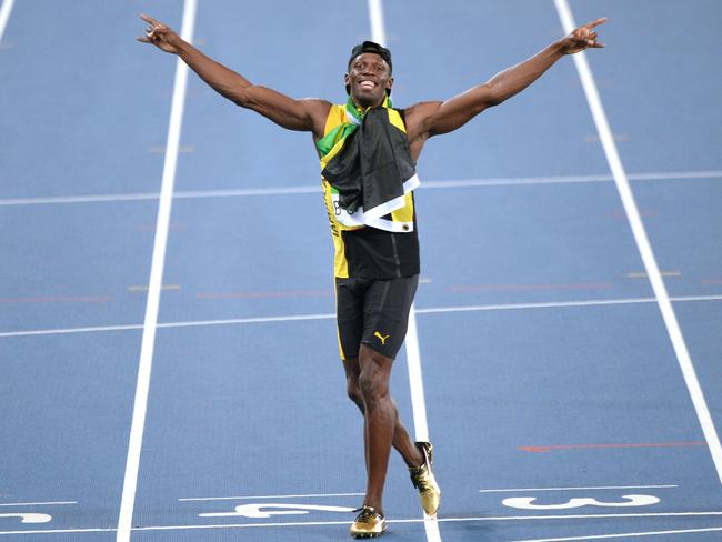 Usain Bolt celebrates after Team Jamaica won the men's 4x100m relay final.