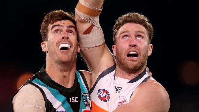 Scott Lycett (left) said the club should know more on China in the next month. Picture: James Elsby/AFL Photos via Getty Images.