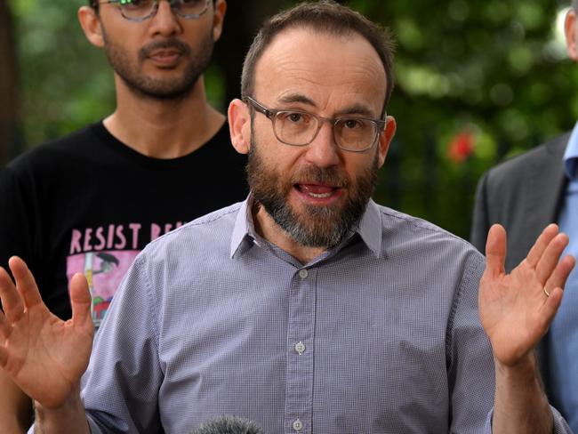 BRISBANE, AUSTRALIA - NewsWire Photos - MARCH 7, 2024.Federal Greens Leader Adam Bandt (right), joined by Greens candidate for mayor, Jonathan Sriranganathan (left) and Greens state MP for Maiwar, Michael Berkman, speaks during a press conference outside Parliament House in Brisbane. Picture: Dan Peled / NCA NewsWire