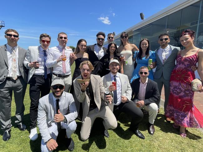 Caitlin, Zac, Mass, Tyler, Rach, Mat, Johann, Nicholas, Kevin, Denz, Austin, Kayla and Lily at the 2024 Oaks Day. Picture: Himangi Singh.