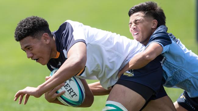 Tylan Berryman tackling Talia Ã’uli in the NSW Waratahs match against the ACT Brumbies.