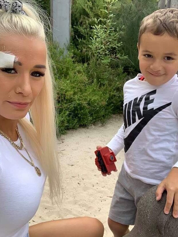 Ellie Price, 26, was found brutally murdered in her South Melbourne home on May 4. Ellie Price, 26, wearing a bandage about her injured eye with four-year-old Mostafa.