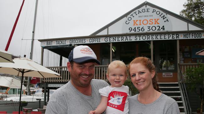 Cottage Point Kiosk owners Trent and Angela Wilson and daughter Sia, soon after they took over. Photo: Adam Ward