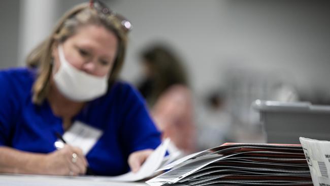 A Gwinnett County election worker processes provisional ballots in Lawrenceville, Georgia. Picture: AFP.