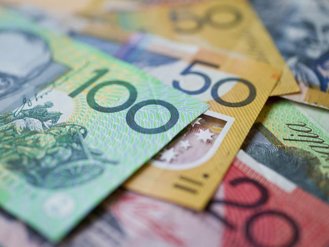 Australian money background showing $100, $50 and $20 notes with a shallow depth of field.