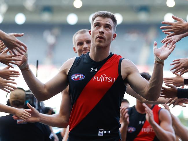 Zach Merrett leads the Bombers off after the win – are they better than last year? Picture: Dylan Burns/AFL Photos