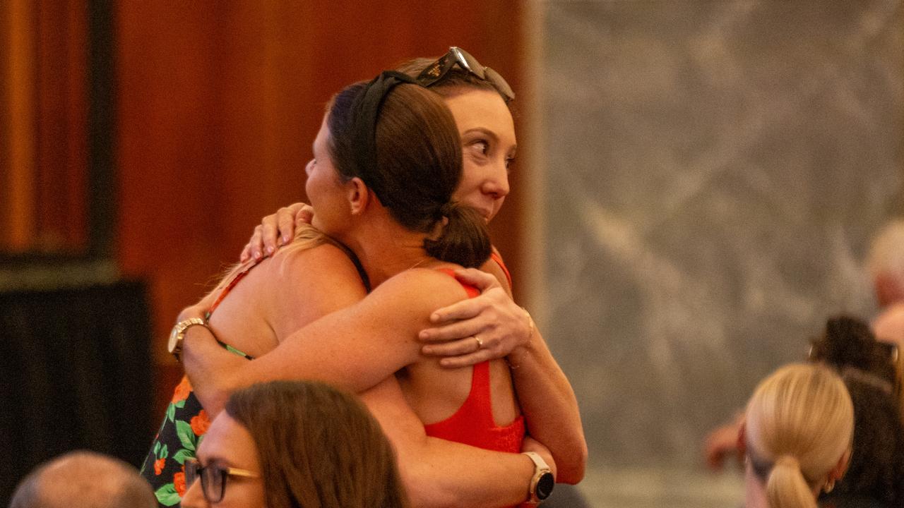 Ms Hoskins’ sister Jess Locke hugging someone before the memorial. Picture: POOL / ABC / Brant Cumming via NCA Newswire