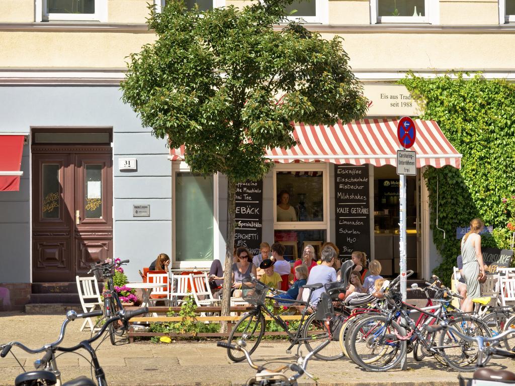 People stop off for a an ice cream at a summer cafe in Prenzlauer Berg Picture: iStock