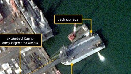 New satellite photos have revealed the construction of a new fleet of D-Day-style landing barges needed to surge troops and tanks over a beach. Picture: @AllSourceA/X