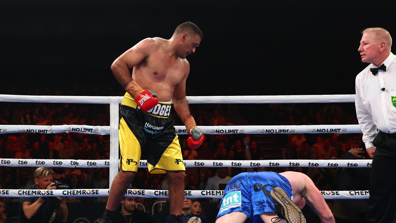 Justin Hodges knocks down Paul Gallen during their September bout at Nissan Arena. Photo by Chris Hyde/Getty Images